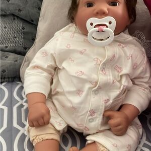 Adorable Baby Doll with Pacifier and White Outfit
